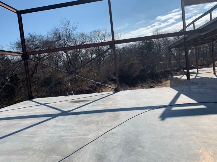 Steel frame over a concrete slab